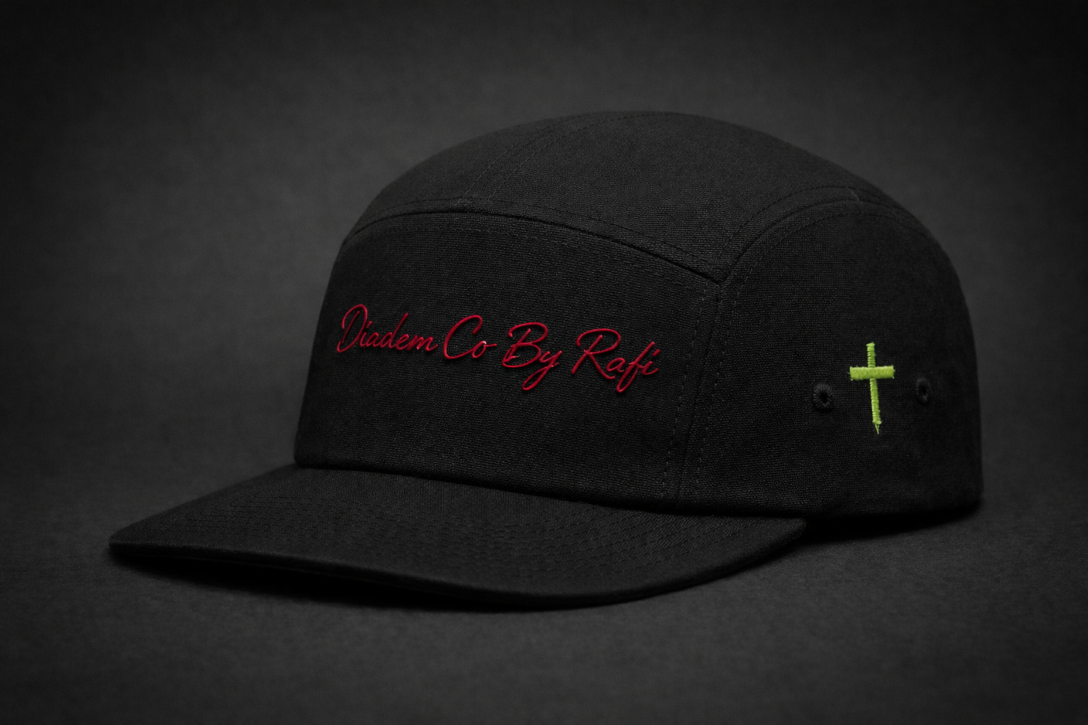 Men's 5 panel black embroidered Diadem Co By Rafi logo in red hats with signature embroidered neon green cross logo on the side.